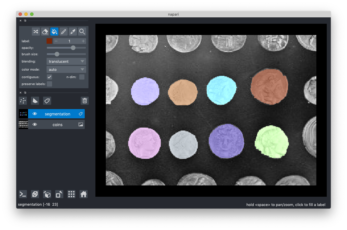 napari viewer showing eight roughly circular shapes, each colored differently. In the left sidebar, the segmentation layer is highlighted.